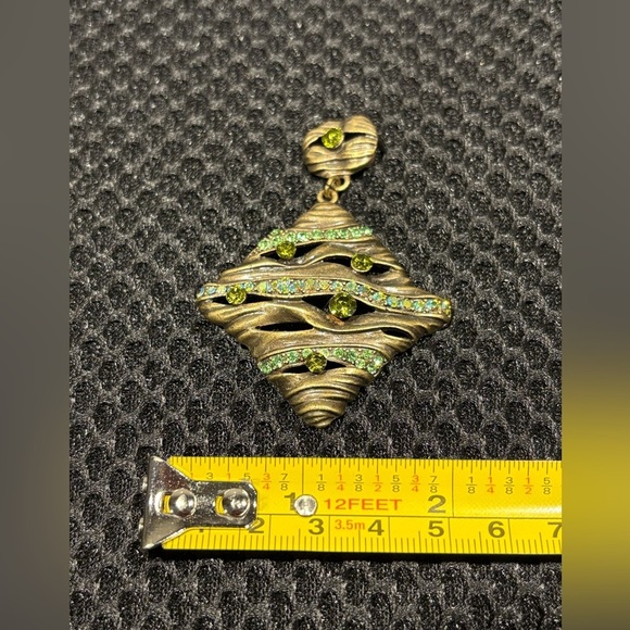 Wavy Textured Gold-Tone Pendant with
Sparkling Green Gems - Picture 6 of 9